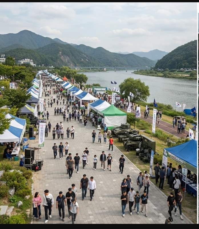 Free outdoor concert stage at the K-Military Festival Chuncheon Riverside Park with crowds watching Ali performance at night