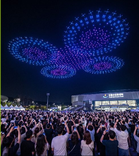 3,000 drones forming patterns above Gangneung Convention Center plaza during the 2026 ITS World Congress Gangneung night opening